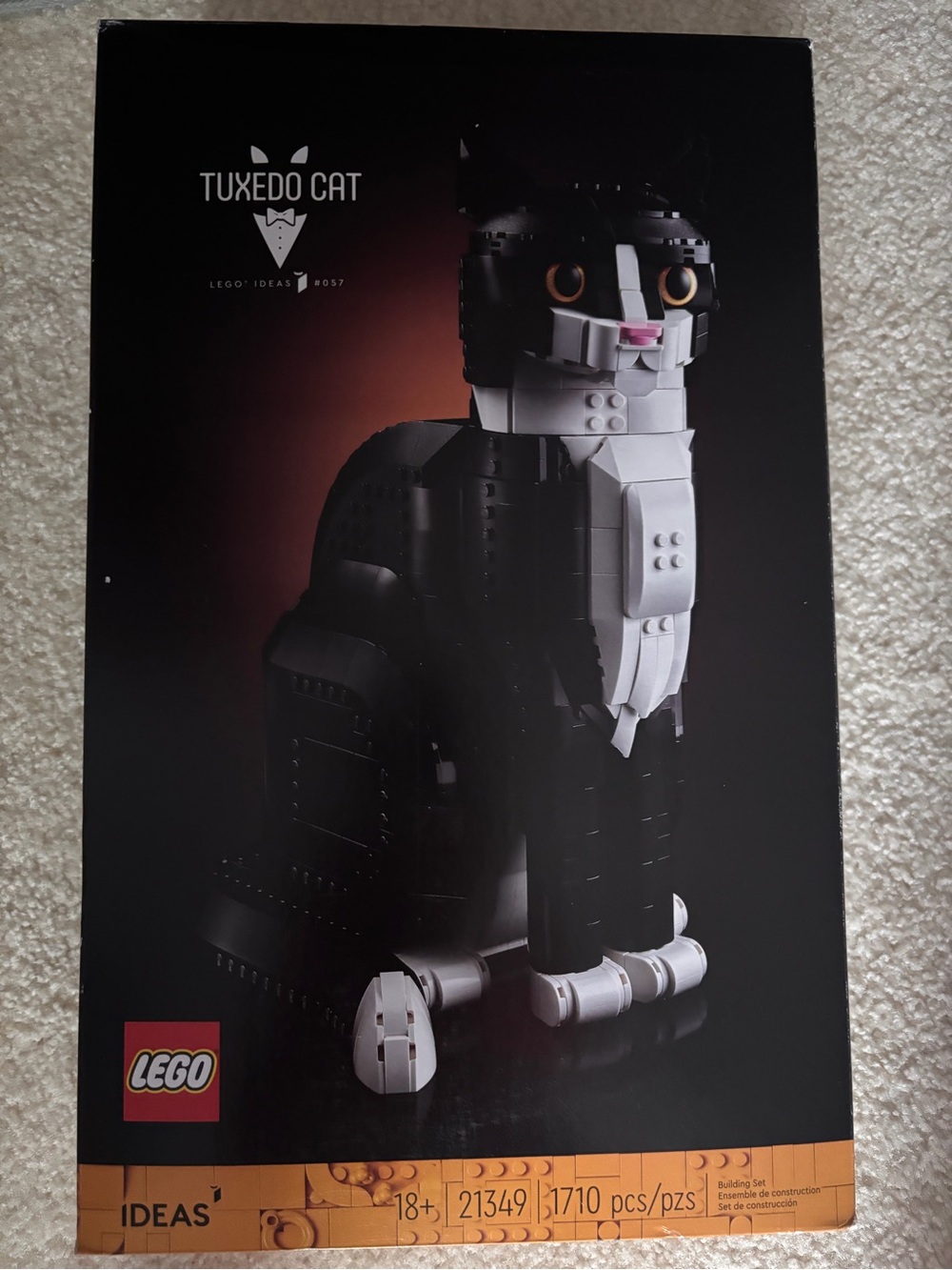 Lego Black and White Tuxedo Cat Model with Orange Eyes and Pink Nose